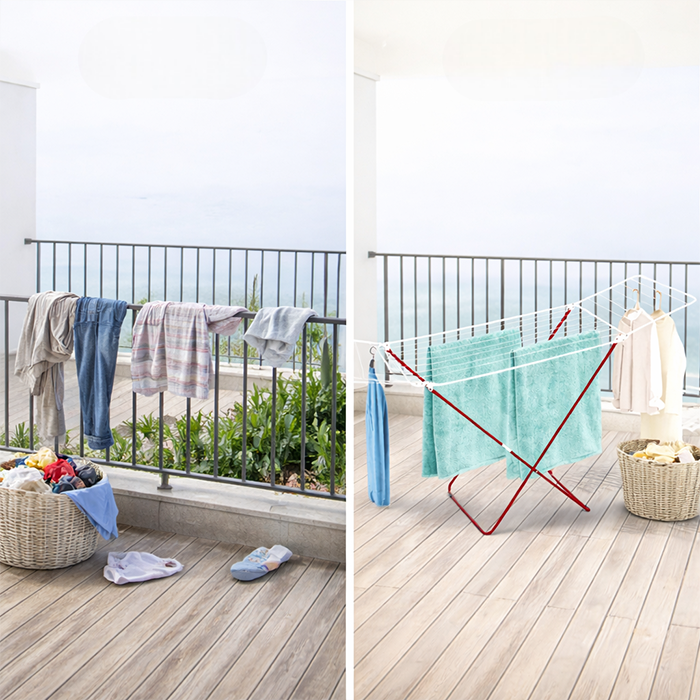 Stainless steel foldable clothes drying stand with towels and garments on a balcony, space-saving laundry rack for home use Qatar