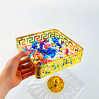 Square storage box filled with colorful sweets, glass lid removed for serving presentation Qatar