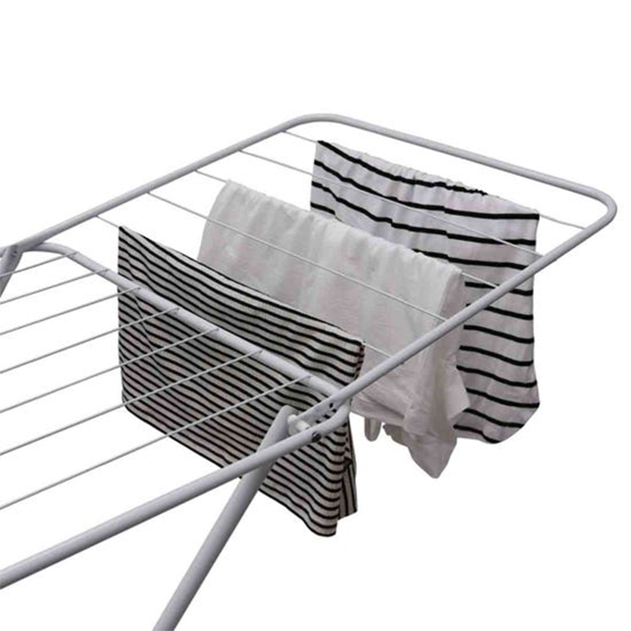 Laundry drying rack with clothes hanging on a foldable clothes drying rack for indoor air drying Qatar