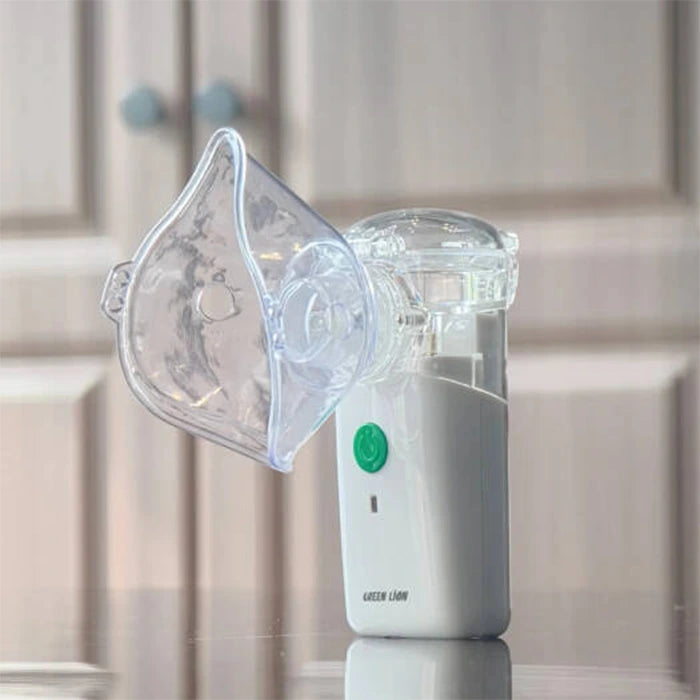 Close view of portable nebulizer device with mask and mist output Homesouq Qatar