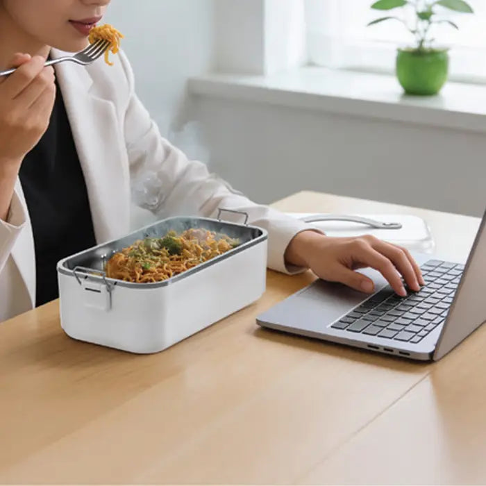 Leak-proof lunch box used while working on laptop with hot food in Homesouq Qatar