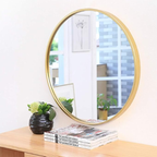 Gold round wall mirror styled on console table for farmhouse home decor Qatar