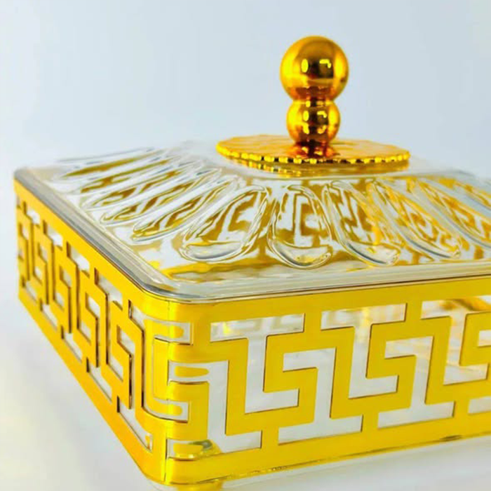 Luxury glass sweet box lid with gold knob and patterned design close-up view Qatar