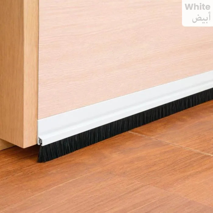 Door stopper installed on wooden door bottom preventing dust entry Homesouq Qatar