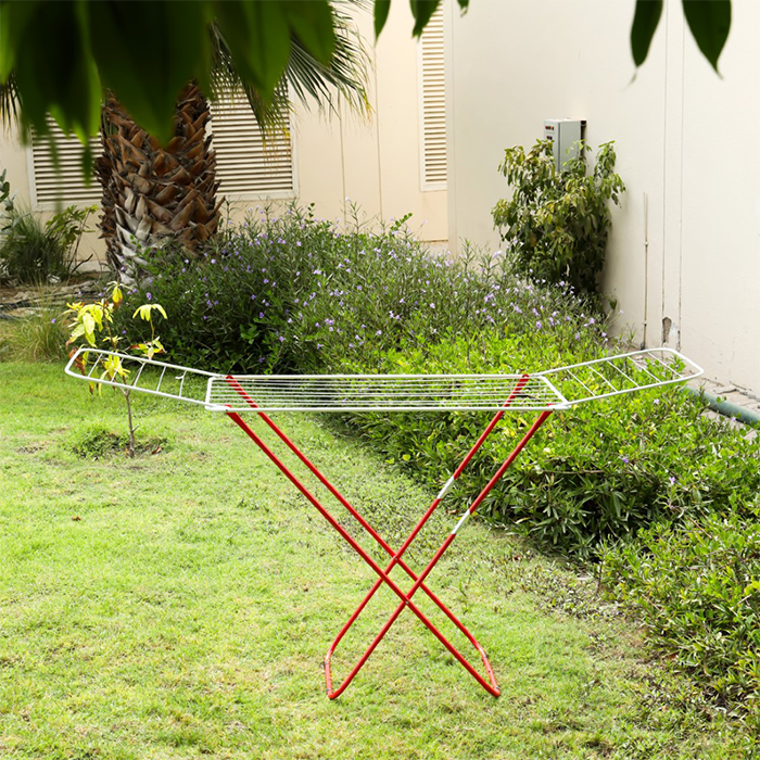 Compact foldable drying stand with red steel frame and white drying lines Qatar