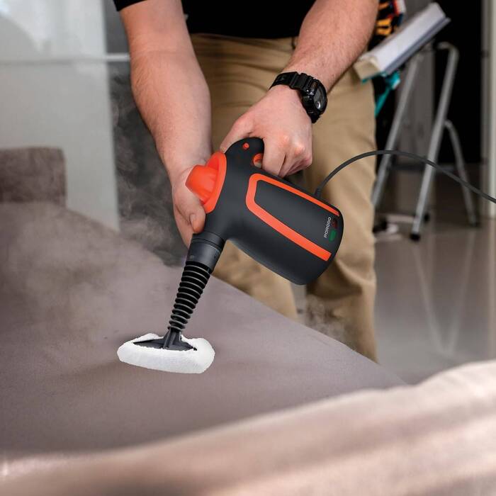 Porodo Lifestyle Steam cleaner removing dirt from carpet using handheld floor attachment Qatar