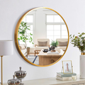 Decorative gold hanging mirror above console table for stylish home decor Qatar
