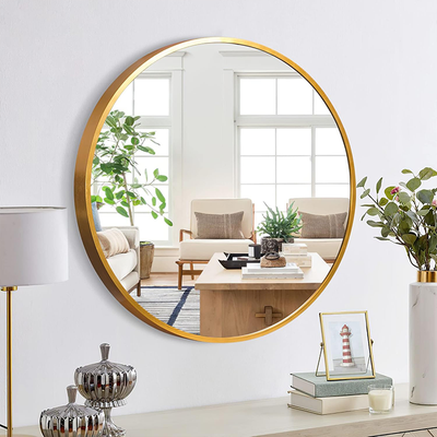 Decorative gold hanging mirror above console table for stylish home decor Qatar