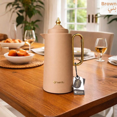 Brown vacuum flask with gold handle on dining table, stylish thermal flask design Qatar