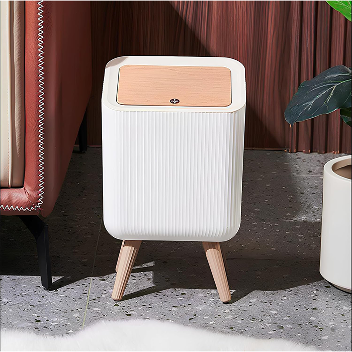 Decorative trash bin for living room with modern furniture setup in Qatar
