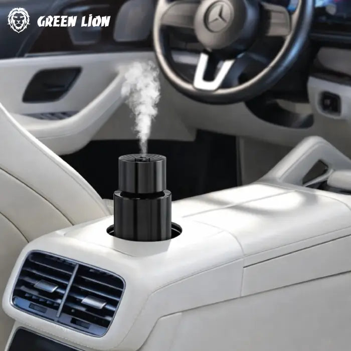 Green Lion diffuser placed in car cup holder releasing mist for fresh air in Green Lion Homesouq Qatar
