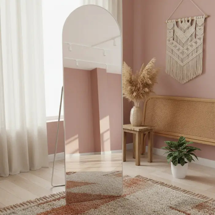 Floor mirror in decorative room setup with plants and soft furnishings Homesouq Qatar