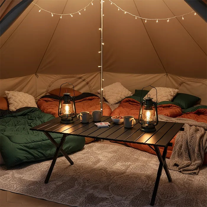 Foldable picnic table placed inside tent setup with lantern lighting and cozy arrangement Homesouq Qatar