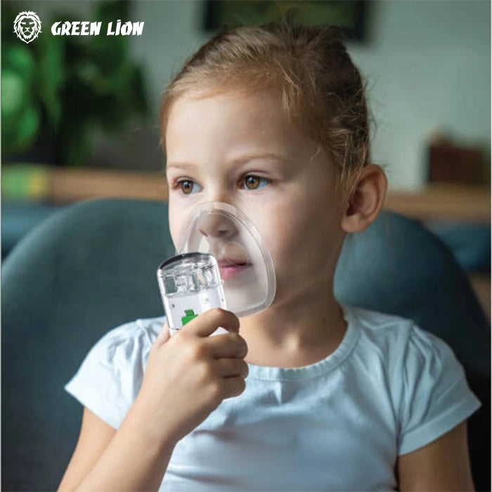 Green Lion portable nebulizer in use with child for respiratory care in Homesouq Qatar