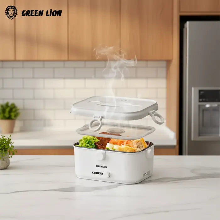 Green Lion electric lunch box heating food with steam on office desk near laptop in Homesouq Qatar