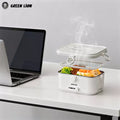 Green Lion electric lunch box heating food with steam on office desk near laptop in Qatar Homesouq Qatar