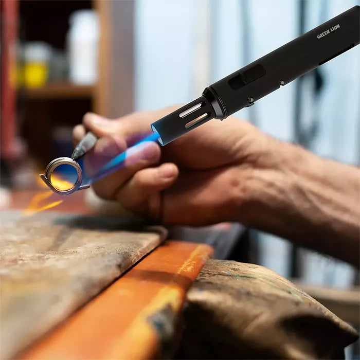 Torch lighter heating metal ring with precision flame tool in Qatar homesouq Qatar