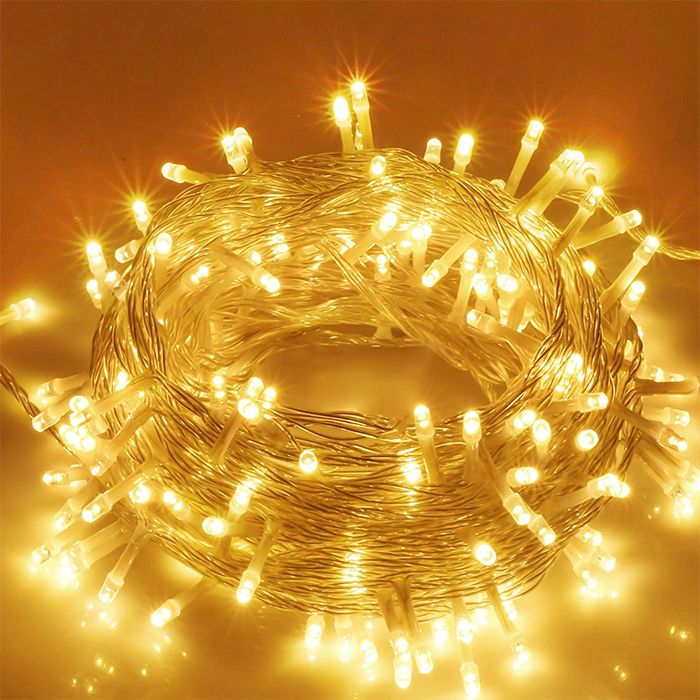 A coil of LED string lights emitting a warm glow, intended for use as decorative lighting.