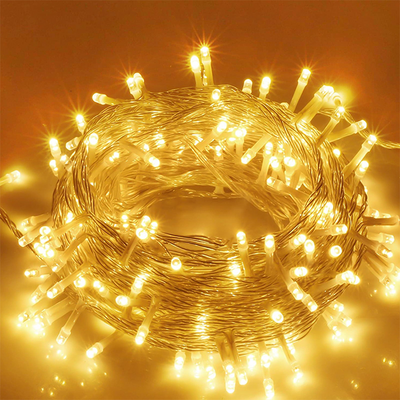 A coil of LED string lights emitting a warm glow, intended for use as decorative lighting.