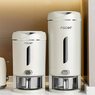 Two white food storage containers with airtight lids, branded ASCOR, designed for dispensing rice and other grains.