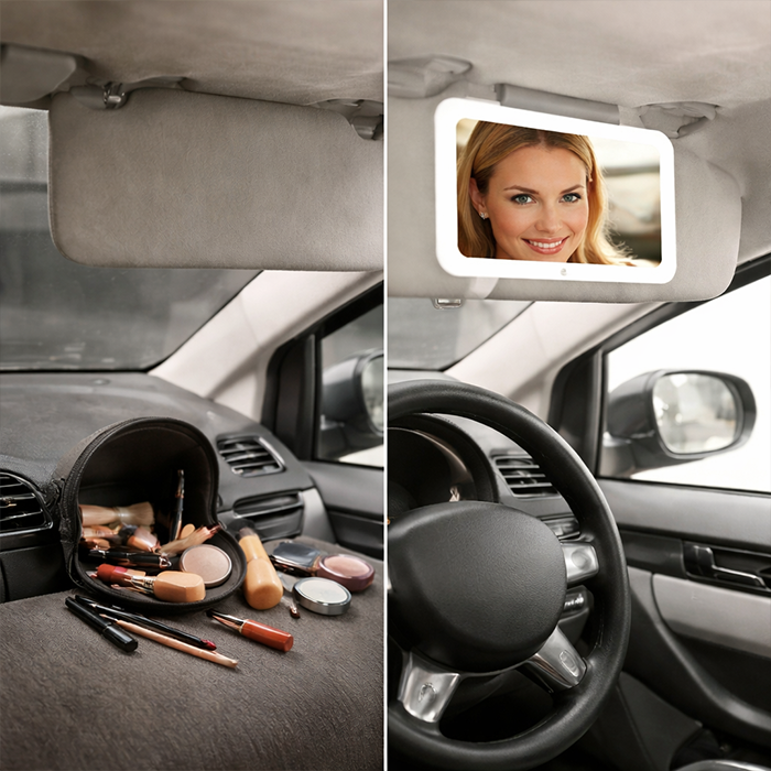 Car interior with cluttered makeup items and visor before using Green Lion makeup mirror homesouq Qatar