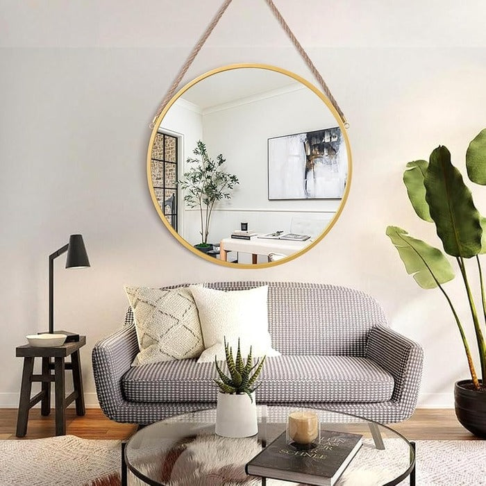 Decorative hanging mirror above sofa with plant and modern home decor interior circle mirror Qatar