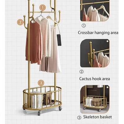 Gold metal cloth stand with crossbar hanging area, hooks and storage basket clothes rack organizer Qatar