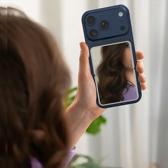 Woman using Green Lion Mirror power bank as vanity mirror on iPhone back panel – Homesouq Qatar