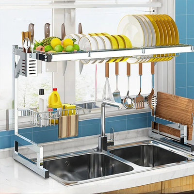 Stainless steel kitchen dish rack with utensil holder and cutting board stand in use Qatar