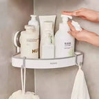 Bathroom accessories corner wall shelf holding shampoo and lotion bottles in bathroom accessories corner wall shelf Homesouq Qatar
