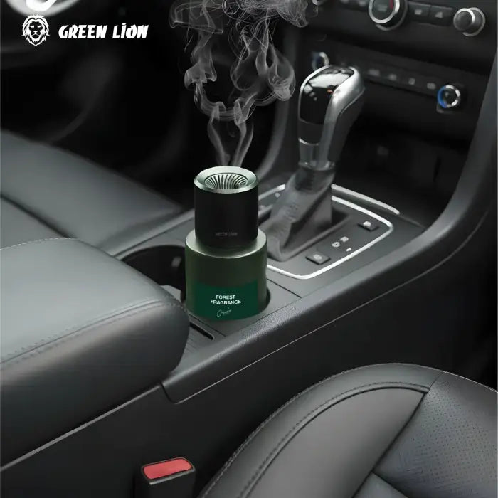 Forest fragrance unit placed in car cup holder with visible vapor mist home fragrance Homesouq Qatar