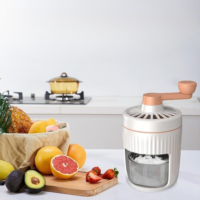 Manual ice crusher placed on kitchen counter with fresh fruits, compact ice grinder for home use in Qatar