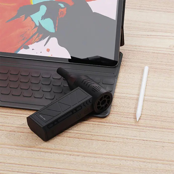 Portable air blower cleaning tablet keyboard setup on desk blower fan usage Homesouq Qatar