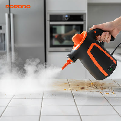 Porodo multi surface electric steam cleaner releasing hot steam on tile floor in Qatar