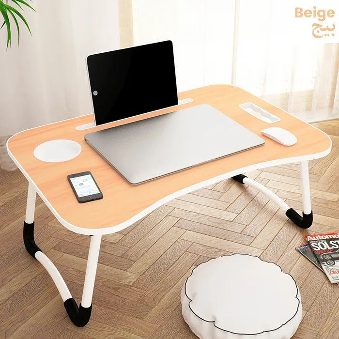 Laptop desk setup with holder and cup space for comfortable work from bed Homesouq Qatar
