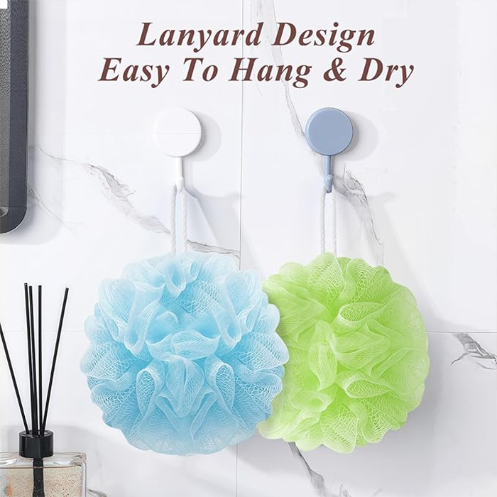 blue and green bath sponge hanging on wall hook with lanyard rope for easy drying after shower Qatar