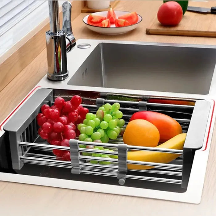 Expandable cleaning basket holding fresh fruits over kitchen sink for draining and storage in Homesouq Qatar