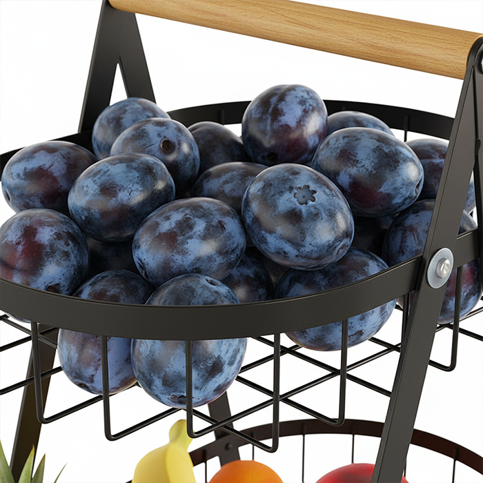 close view of top tier fruit basket with plums and steel mesh design Homesouq Qatar