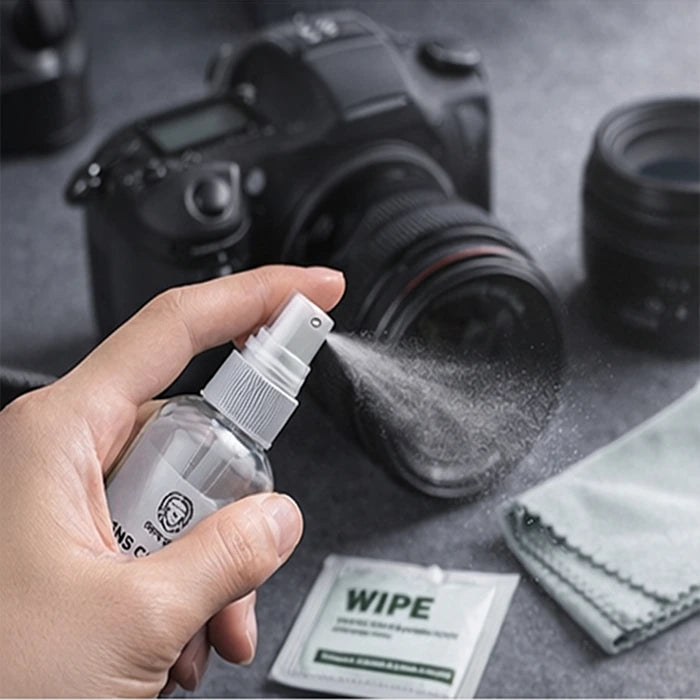 Spraying lens cleaning solution on camera lens with Green Lion kit in Homesouq Qatar