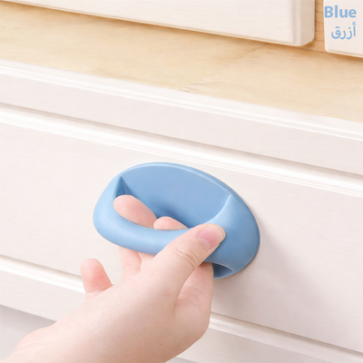 Blue adhesive cabinet handle grip installed on a drawer, ergonomic soft-touch pull handle for easy opening Qatar