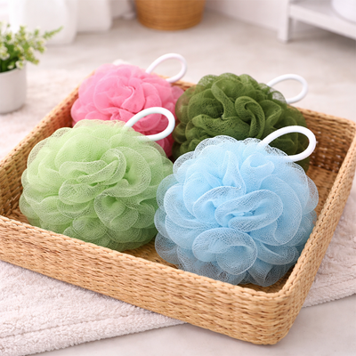 4 pcs bath sponge mesh loofah set in soft pastel colors displayed in basket for shower use Qatar