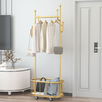 Gold hanging rack cloth hanger stand with clothes displayed in modern home interior Qatar