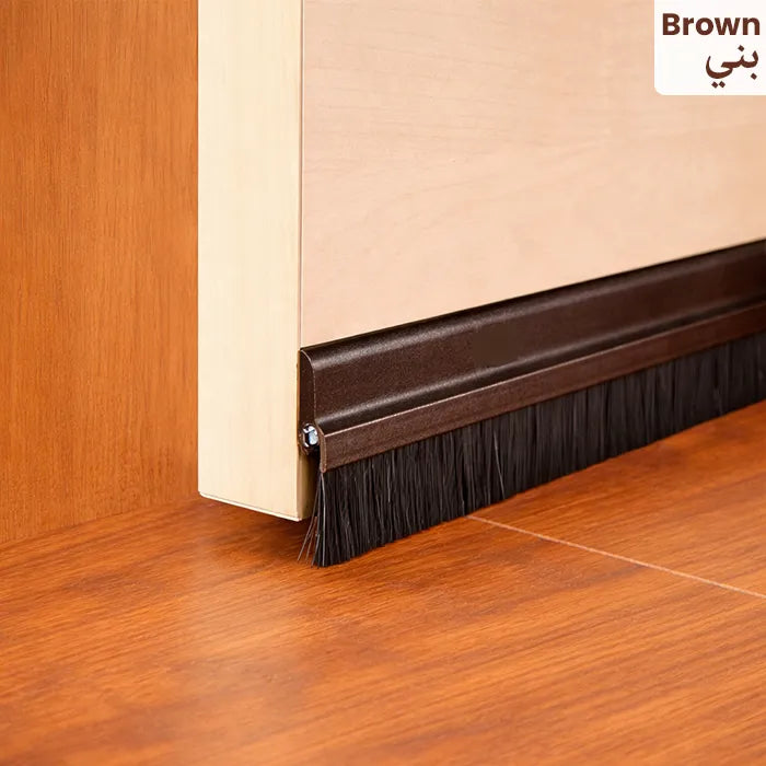 Brown seal strip attached to door bottom for blocking airflow and debris Homesouq Qatar