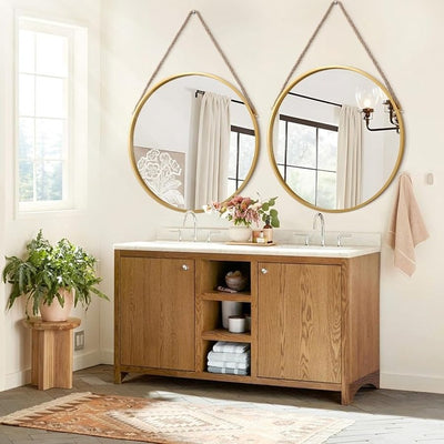 Gold circle mirror hanging above bathroom vanity with wooden cabinet home decor mirror Qatar