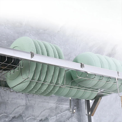 Plates drying on stainless steel kitchen dish rack with water draining structure Homesouq Qatar